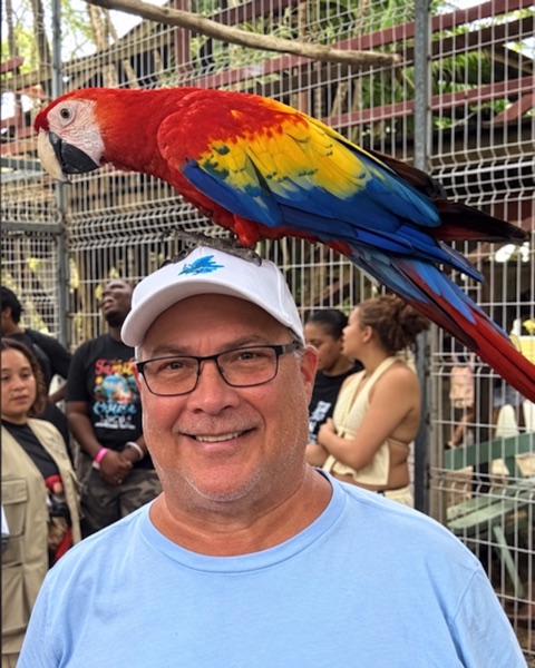 Brent Beasley with a scarlet macaw